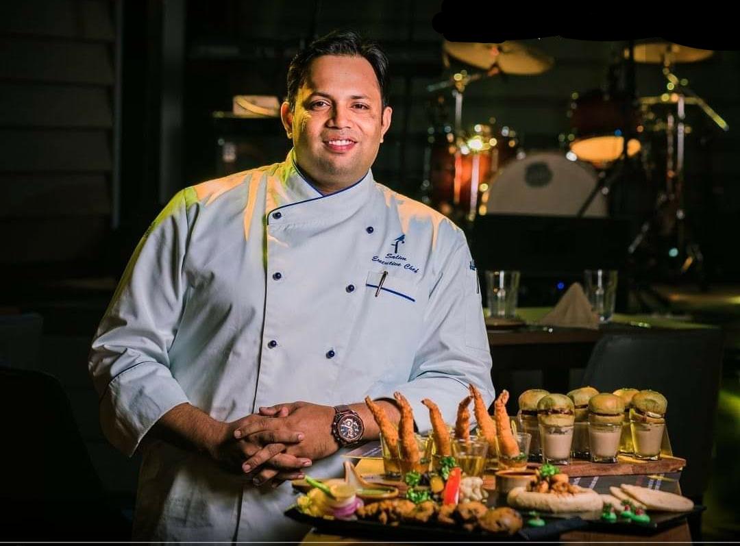 Chef Salim with signature dishes